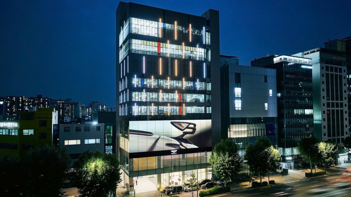 Bentley Seoul Tower with illuminated windows at night time